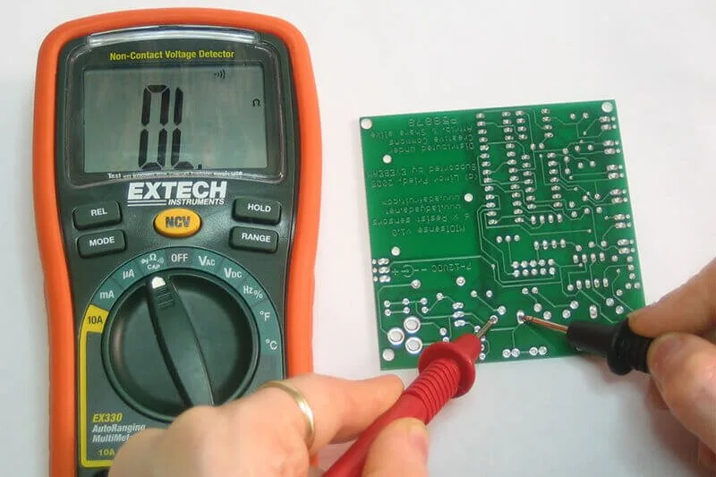 multimeter testing garage door opener board